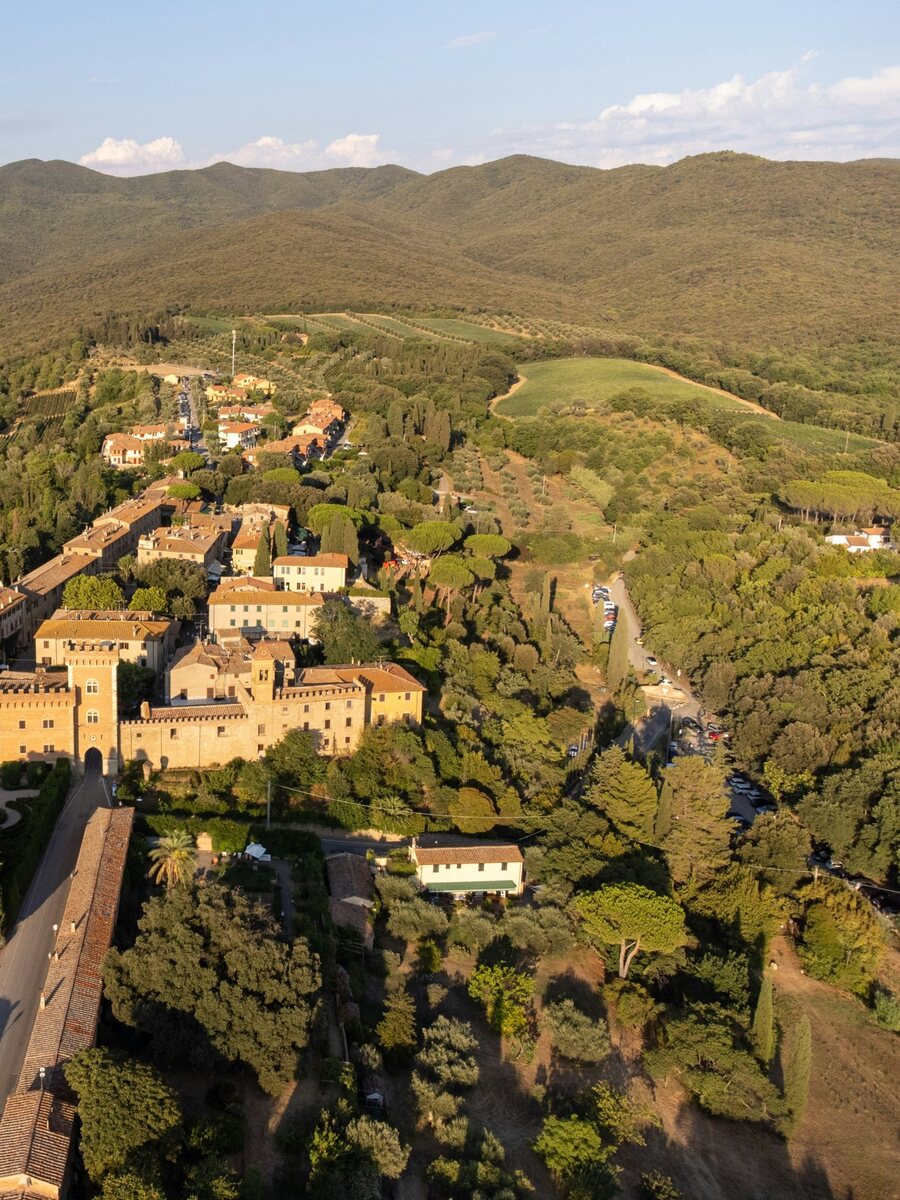 The castle gate and village of Bolgheri from above, below the Colline Metallifere