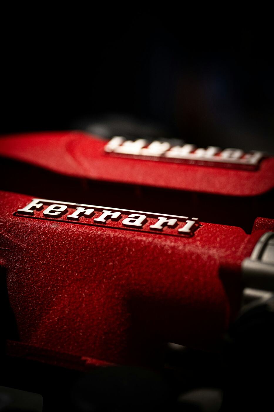 A Ferrari engine with its red cam covers