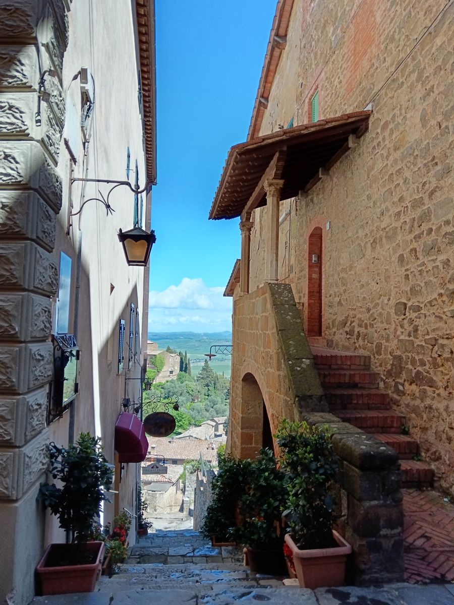 A stepped lane in Montalcino opening onto the Val d'Orcia