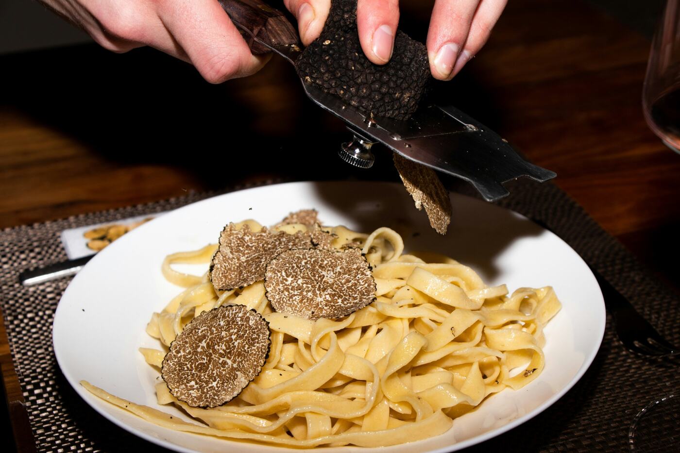 Black truffle shaved over fresh tagliatelle