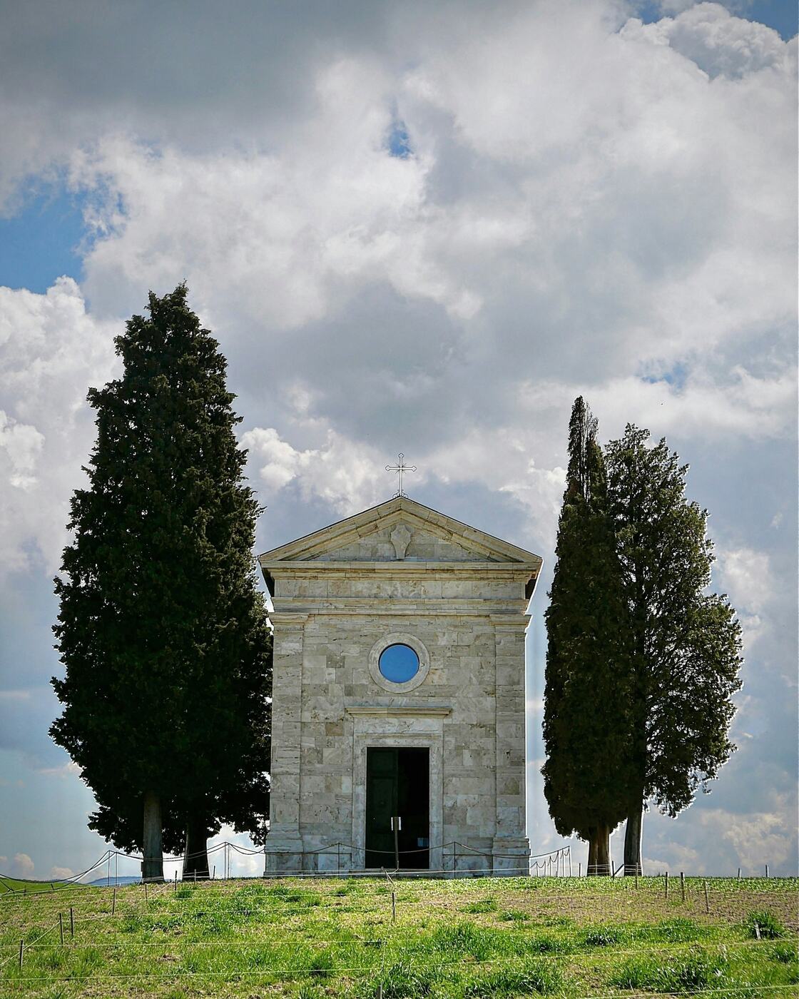 The little chapel of Vitaleta between its cypresses